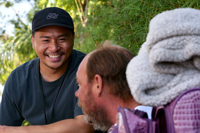 A PATH outreach specialist assists a homeless person.