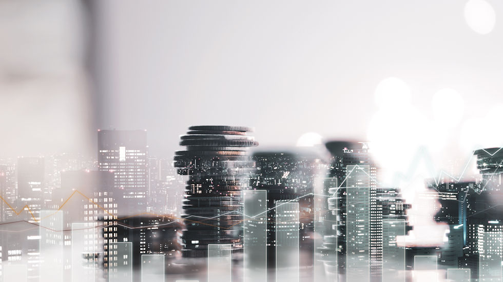 Collage image of stacks of coins and office skyline.