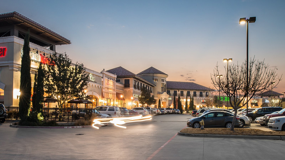 Open air shopping center at dusk.