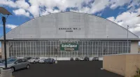 A former airplane hangar in Denver was converted to mixed-use as part of the redevelopment of the area, with restaurants, retail sites, and self-storage.
