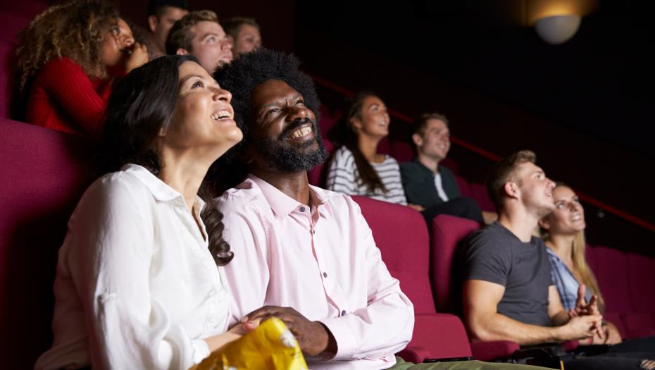 Close shot of a couple at the movies.