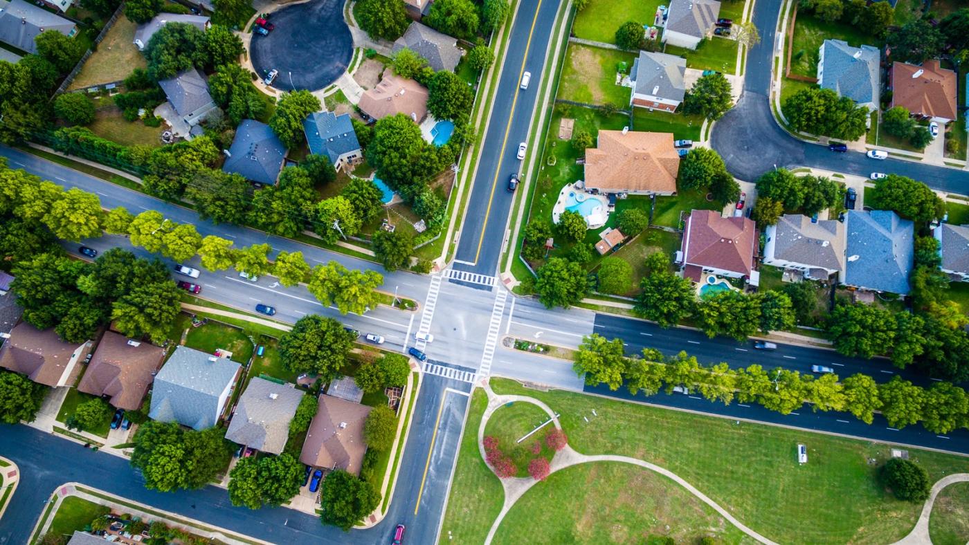 Top view from a crossroads on a residential area.