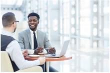 Photo of people talking at a table