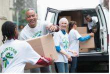 Volunteers loading supplies into a van