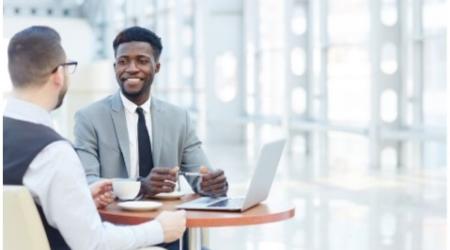 Photo of people talking at a table