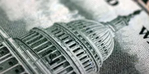 Close-up of U.S. Capitol shown on U.S. currency.